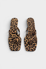 Cheetah print thong mule heels with matching insoles and kitten heels.