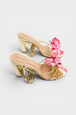 Gold slip-on sandal heels with printed orchid flower accents.