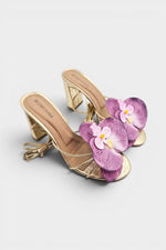Gold slip-on sandal heels with lavender silk orchid flower accents.