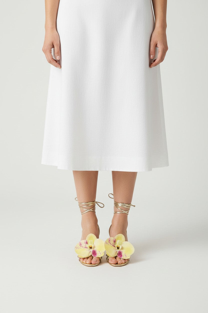 Gold slip-on sandal heels with printed orchid flower accents.