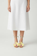 Gold slip-on sandal heels with printed orchid flower accents.