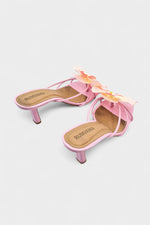 Pink slip-on sandal heels with silk orchid flower accents.