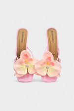 Pink slip-on sandal heels with silk orchid flower accents.