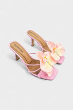 Pink slip-on sandal heels with silk orchid flower accents.