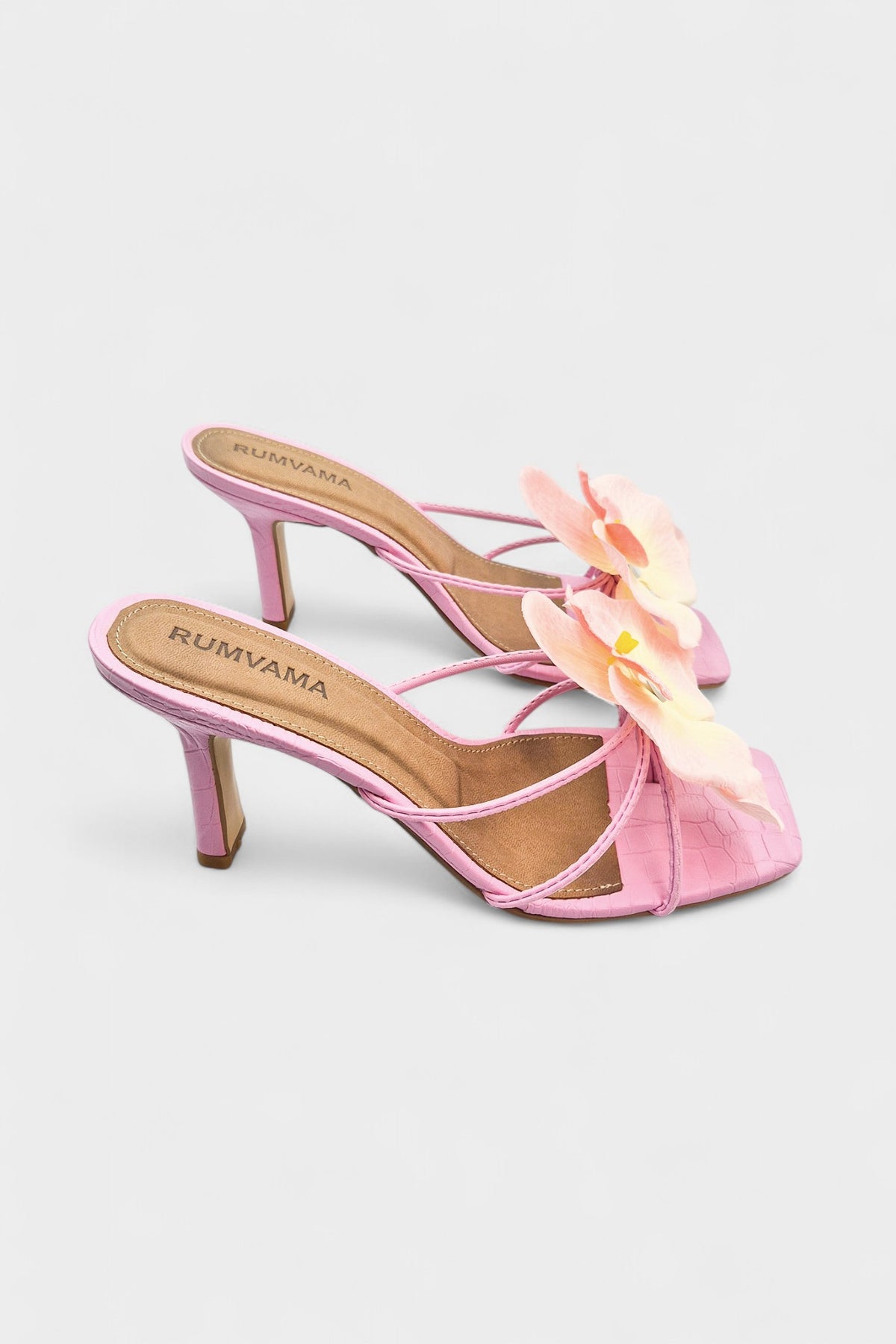 Pink slip-on sandal heels with silk orchid flower accents.