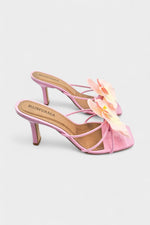 Pink slip-on sandal heels with silk orchid flower accents.