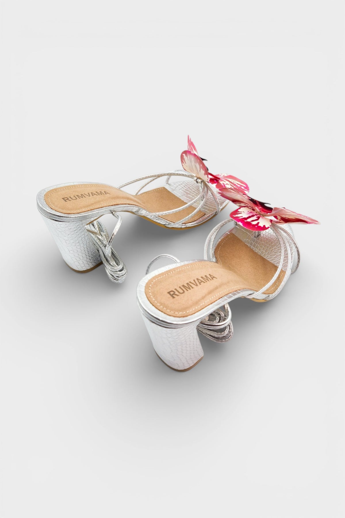 Silver slip-on sandal heels with printed orchid flower accents.