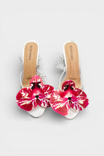 Silver slip-on sandal heels with printed orchid flower accents.