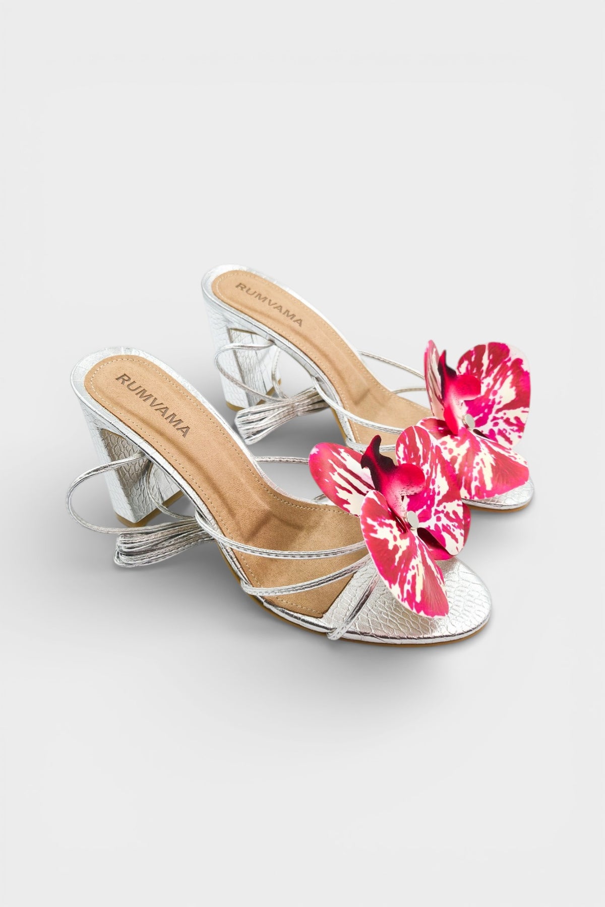 Silver slip-on sandal heels with printed orchid flower accents.