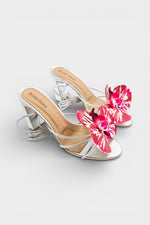 Silver slip-on sandal heels with printed orchid flower accents.
