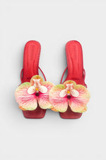 Red slip-on sandal heels with printed orchid flower accents.