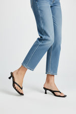 Black thong sandal mules with cheetah print insoles and kitten heels.