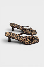 Cheetah print thong mule heels with matching insoles and kitten heels.