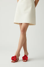 Cherry slip-on sandal heels with red silk orchid flower accents.