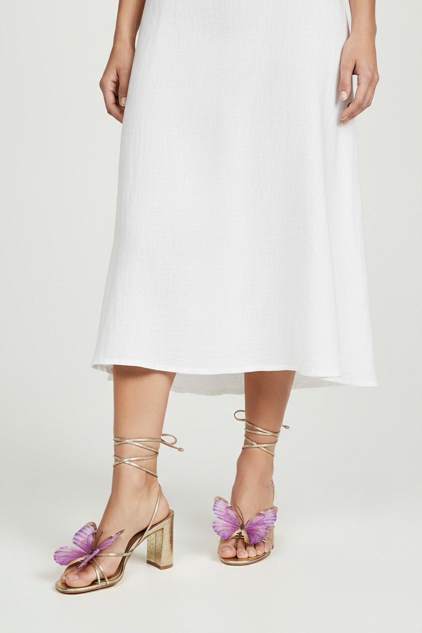 Gold slip-on sandal heels with lilac silk butterfly accents.