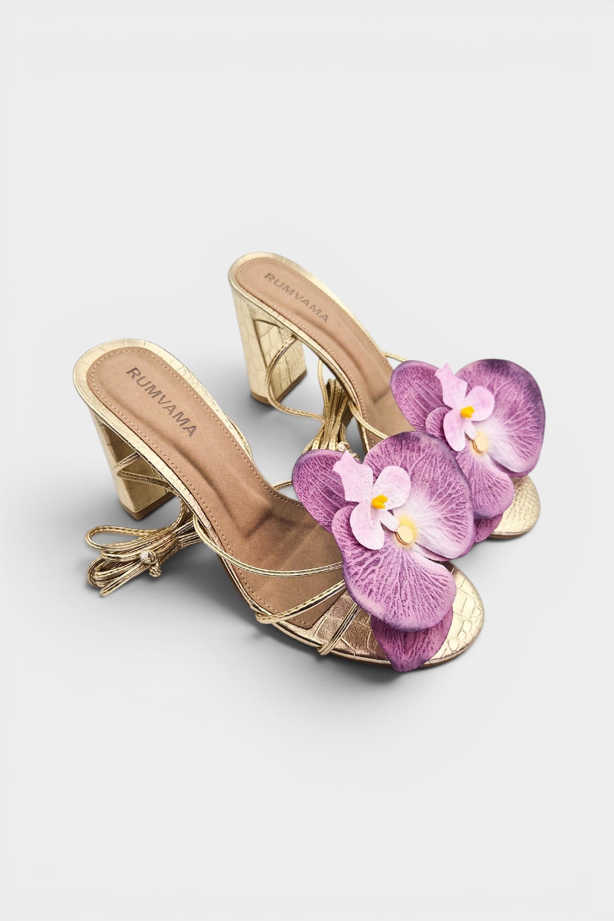 Gold slip-on sandal heels with lavender silk orchid flower accents.