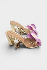 Gold slip-on sandal heels with lavender silk orchid flower accents.