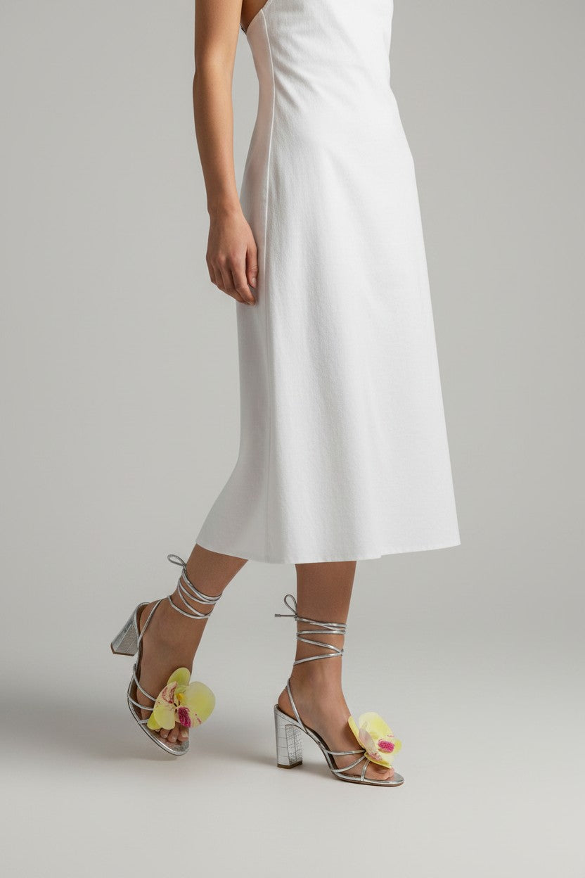 Silver slip-on sandal heels with printed orchid flower accents.