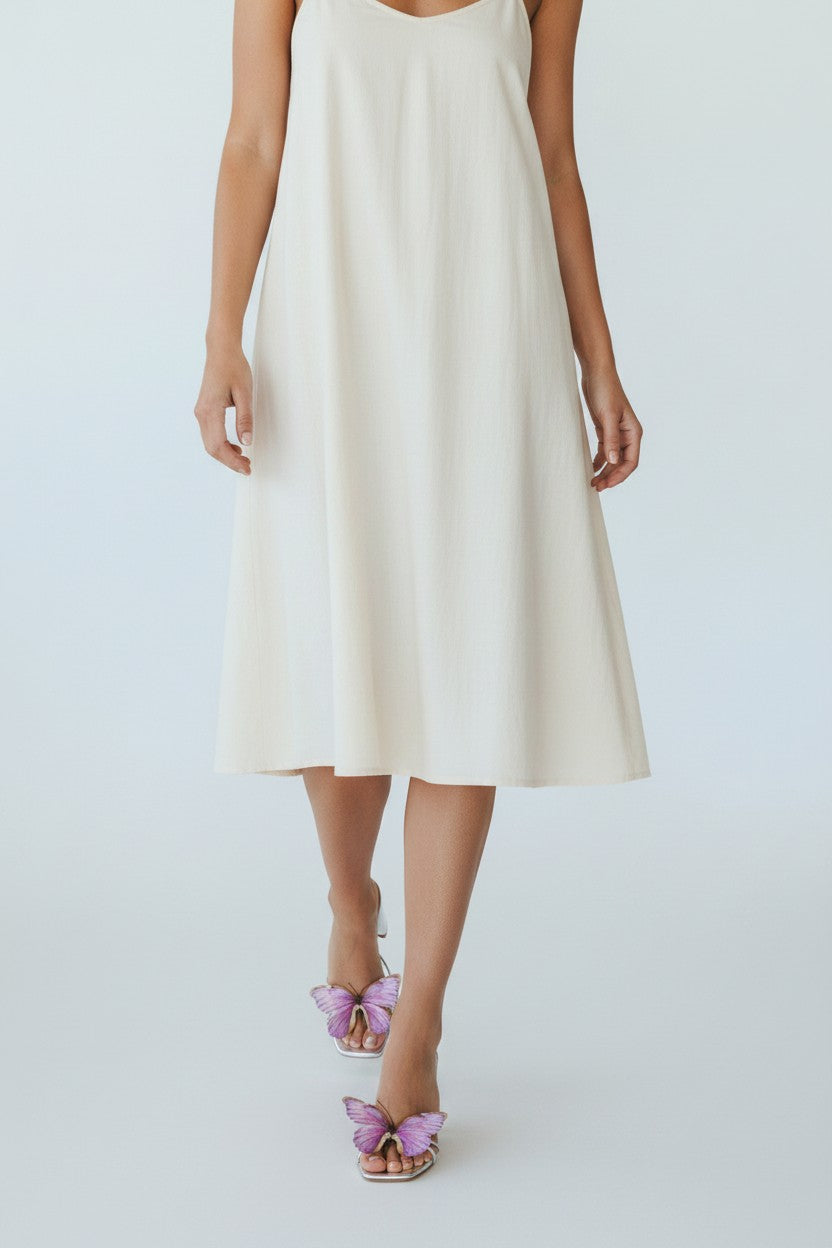 Silver slip-on sandal heels with lilac silk butterfly accents.