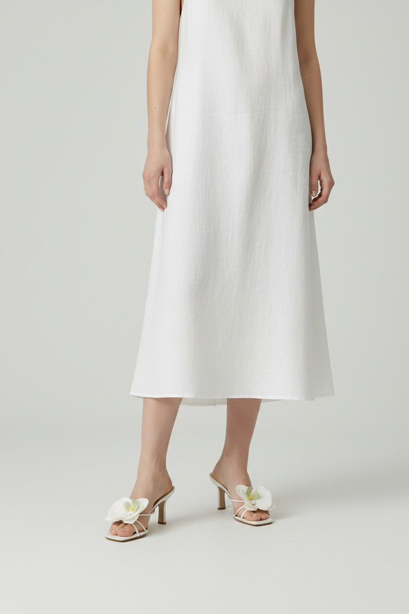 Pearl slip-on sandal heels with white silk orchid flower accents.