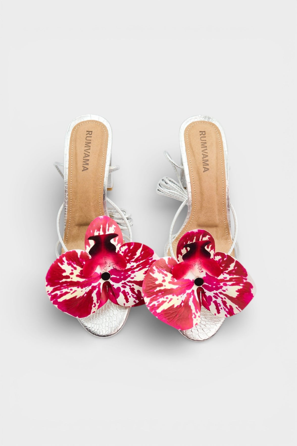 Silver slip-on sandal heels with printed orchid flower accents.