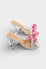 Silver slip-on sandal heels with printed orchid flower accents.