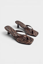 Snake print thong mule heels with matching insoles and kitten heels.