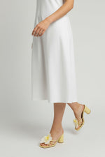 Yellow slip-on sandal heels with white silk orchid flower accents.