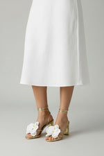 Gold slip-on sandal heels with white silk orchid flower accents.